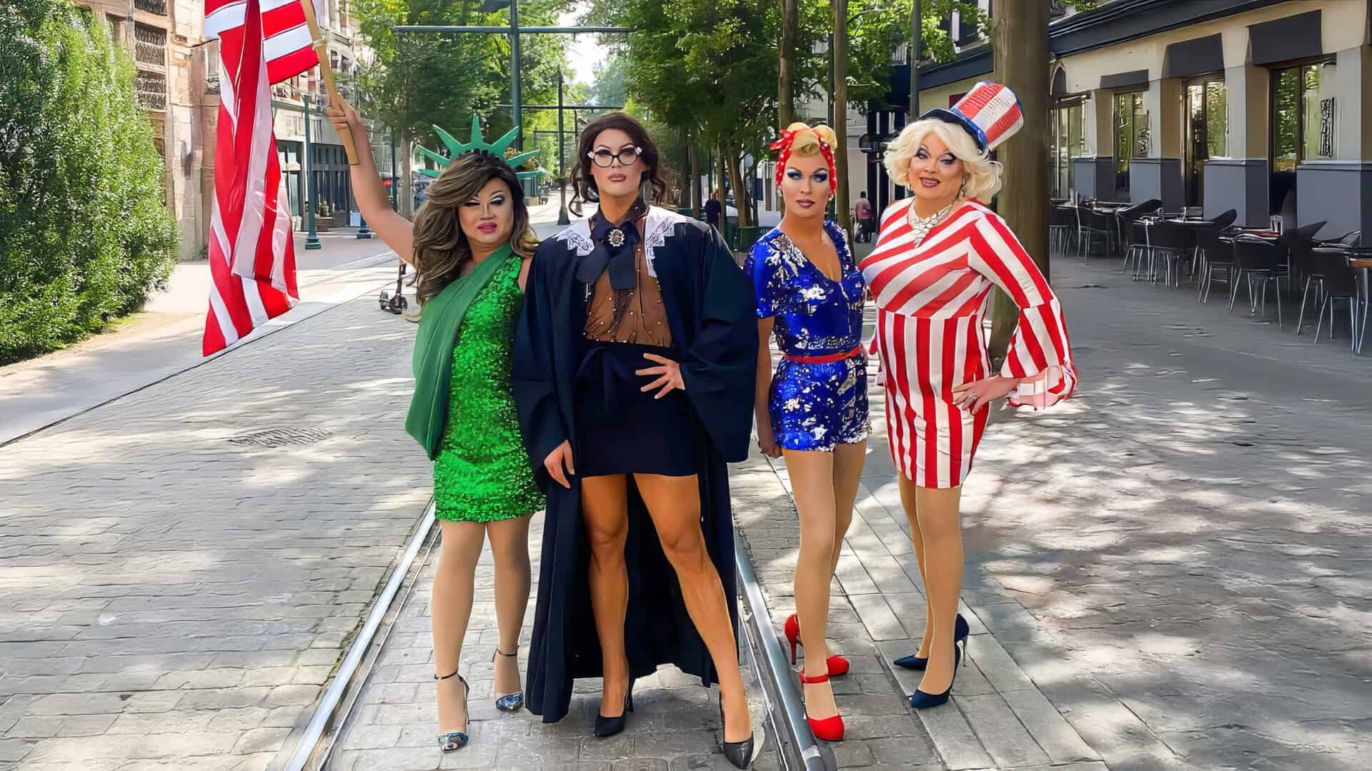 Friends of George's performers on stage with an American flag backdrop