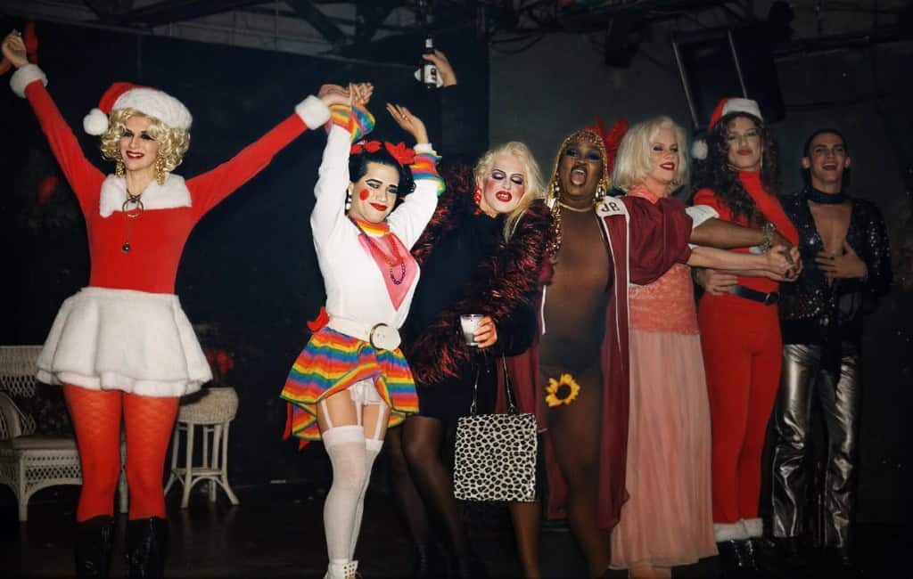 Amnesia cast in festive costumes on stage at George's, Memphis