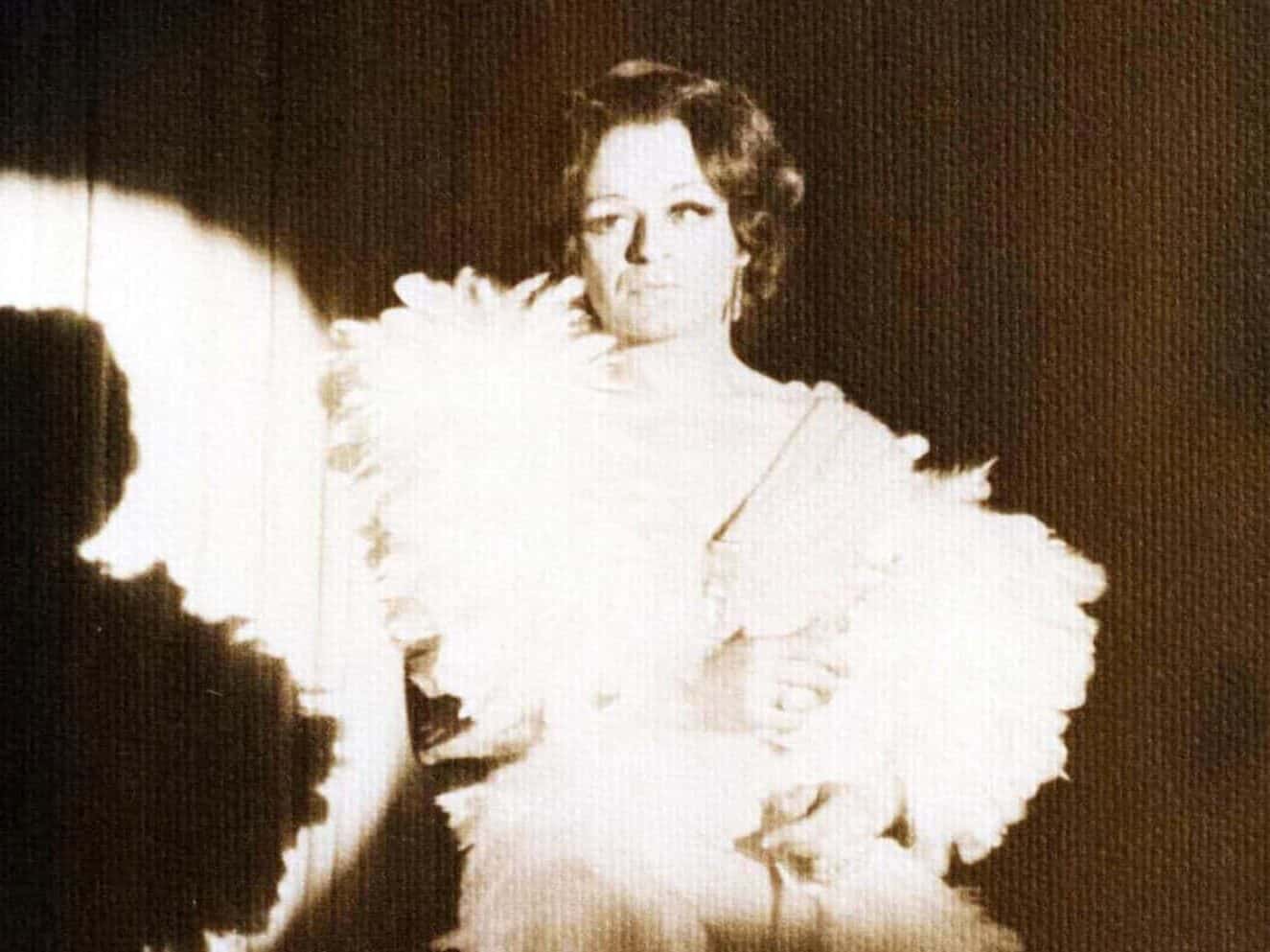 Danielle (Don Rossignol) in feathered costume performing at George's