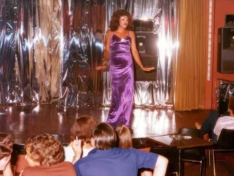 Peaches in a purple gown performing at George's on Madison, Memphis