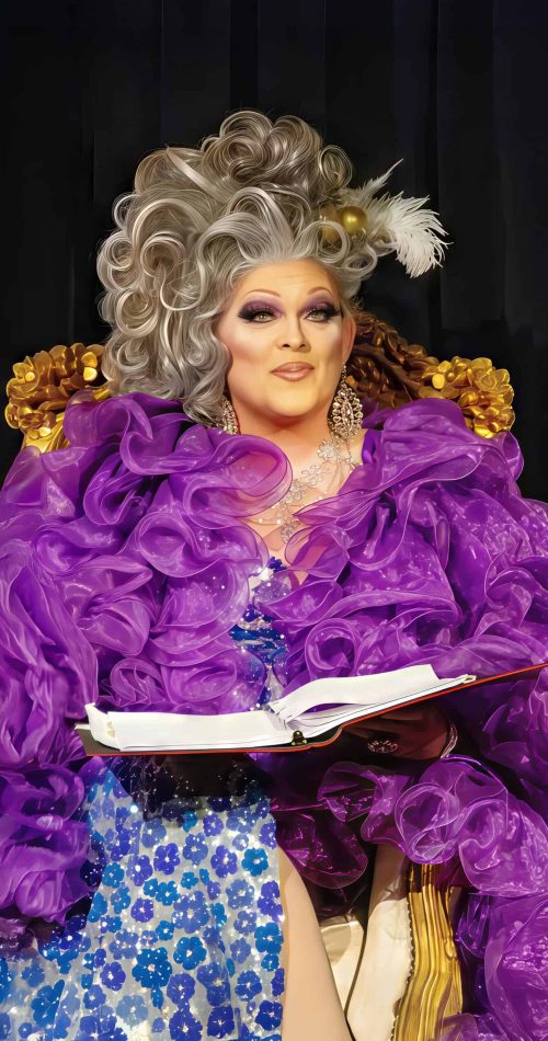 Performer in feathered gown and elaborate makeup on stage at Evergreen Theatre. — friendsofgeorges.org